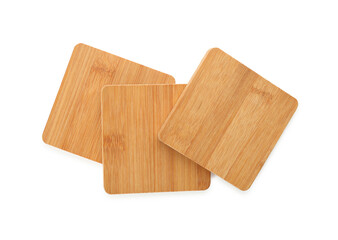 Wooden cup coasters on white background, top view