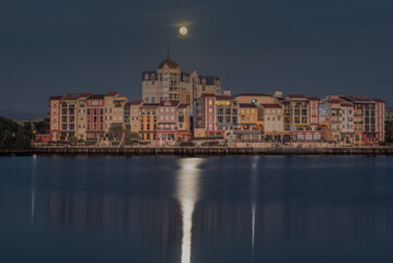 Fototapeta na wymiar The moon setting over the Gold Coasts' French Quarter at Emerald Lakes.