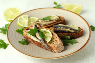 Concept of tasty snack with sandwiches with sprats