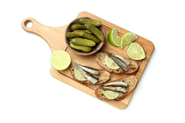 Board with sandwiches with sprats isolated on white background