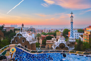 Fototapeta Barcelona city view from Guell Park. Sunrise view of colorful mosaic building in Park Guell obraz