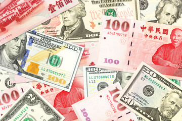 Fototapeta na wymiar some taiwan dollar bank notes and us dollar bank notes mixed indicating bilateral economic relations