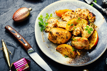 Chicken meat baked with orange.