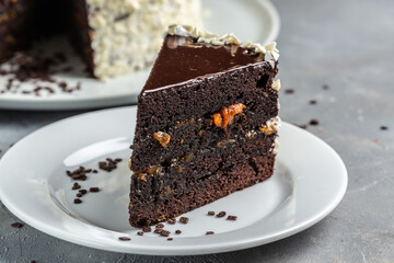 Slice of tasty homemade chocolate cake. Food recipe background. Close up