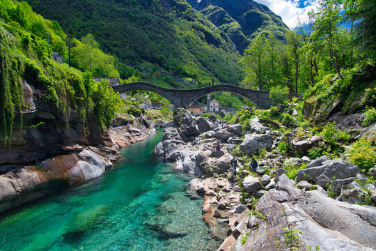Ponte dei Salti Lavertezzo, stone bridge over the Verzasca river in Switzerland in spring 2021