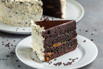 Chocolate cake covered with white cream, homemade baking dessert