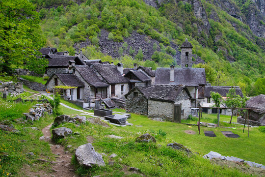 Stone houses an Waterfall Val Bavona, Cevio in Switzerland spring 2021