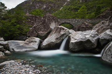 Naklejka na ściany i meble Stone houses an Waterfall Val Bavona, Cevio in Switzerland spring 2021