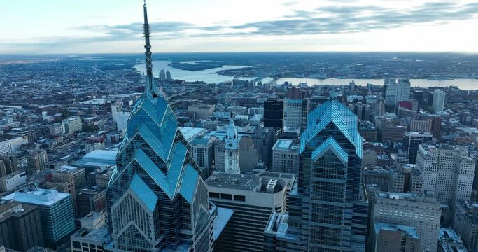 Dramatic cityscape during blue hour. Aerial turn reveals American city skyline, cityscape.