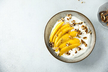 Yogurt with granola and mango