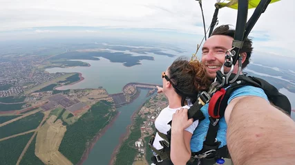 Tuinposter Skydive tandem selfie above Itaípu Dam, between Brazil and Paraguay. © Mauricio G