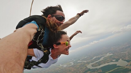 Skydive tandem selfie above Itaípu Dam, between Brazil and Paraguay. - 477626480
