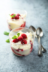 Homemade meringue trifle with custard and raspberries