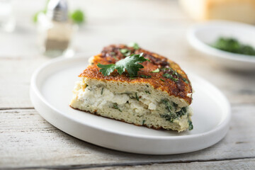 Traditional homemade frittata with herbs and cheese