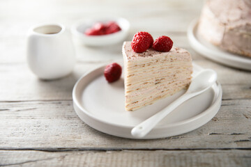 Homemade crepes cake with raspberry cream