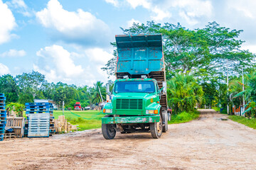 Dump tipper truck on in the jungle tropical nature Mexico.