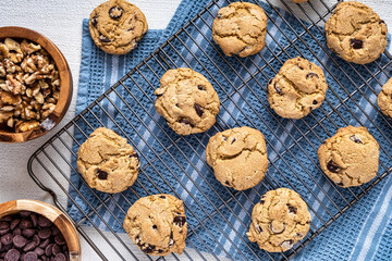 Chocolate chip cookies on a cooling rack - 477629410