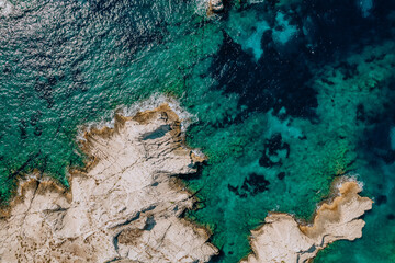 Aerial shot of a drone with crystalline waters of the coast of Frioul islands, Marseille.