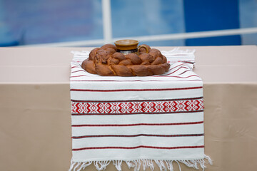 Shallow depth of field (selective focus) details with Romanian traditional greeting with bread and...