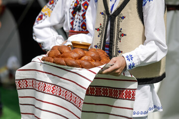 Shallow depth of field (selective focus) details with Romanian traditional greeting with bread and...