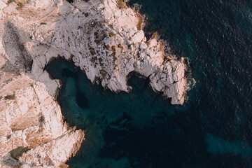 Aerial shot of a drone revealing the crystalline waters in the coast of Frioul islands, Marseille.