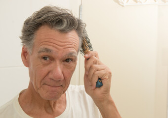 Mature Man Brushing an Combing his Hair