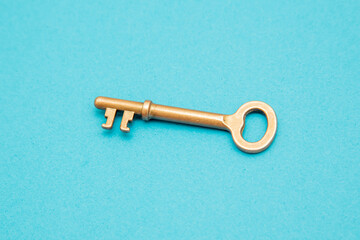 Isolated old skeleton key on blue background