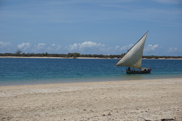 Traditional dhow navigating between Lamu Island and Manda Island