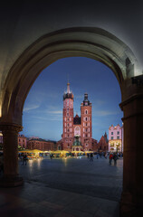 Fototapeta premium St. Mary's Basilica and Cloth Hall Arches at night - Krakow, Poland