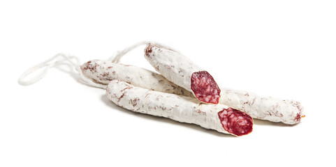 Traditional Spanish thin dried sausage Fuet. Isolated on a white background. Moldy salami smoked pork sausages 