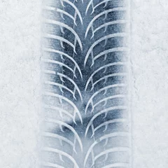 Deurstickers Car tire track in the snow. Concept for transport and winter tires in winter time. © montypeter