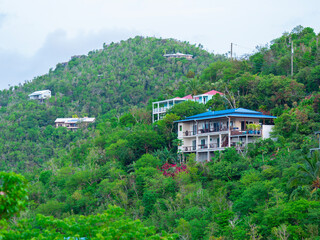 Fototapeta na wymiar Homes on the mountain top in the U.S. Virgin Islands