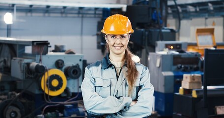 Portrait of a professional heavy industry engineer worker in uniform, goggles and hard hat at a...