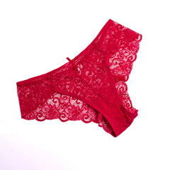 Red women's lace panties. On a white, isolated background.