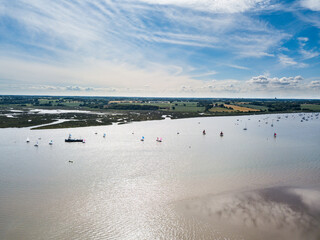 Sutton Suffolk UK June 26 2021: Small sailing boats out on the River Deben in Suffolk on a clear and warm summers day