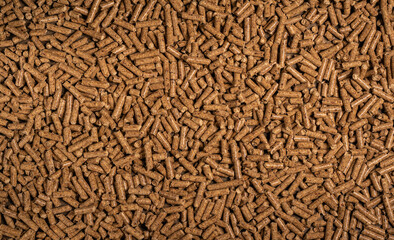 Wood pellets - close-up, background, cheap energy.
