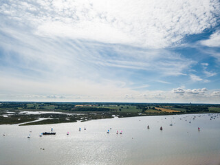 Sutton Suffolk UK June 26 2021: Small sailing boats out on the River Deben in Suffolk on a clear...