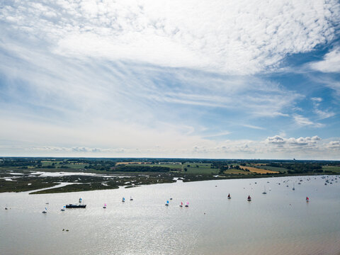 Sutton Suffolk UK June 26 2021: Small sailing boats out on the River Deben in Suffolk on a clear and warm summers day
