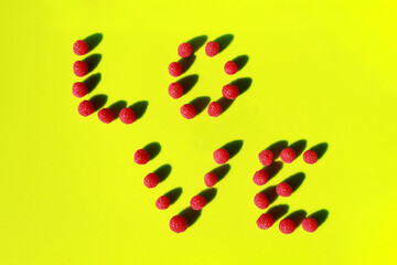 raspberry love raspberry pattenr on a green background