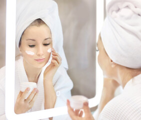 Magic anti-aging cream.Applying the cream.