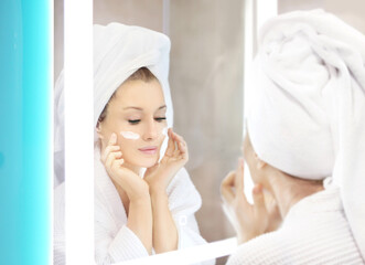 Magic anti-aging cream.Applying the cream.