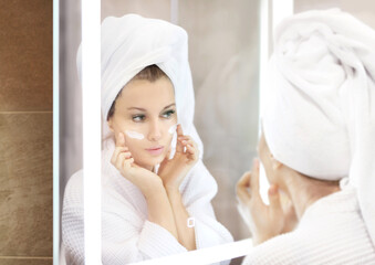 Magic anti-aging cream.Applying the cream.