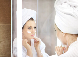 Magic anti-aging cream.Applying the cream.