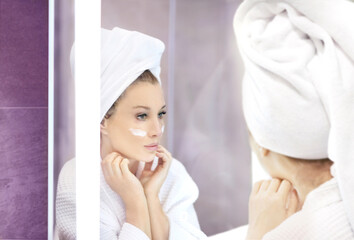 Magic anti-aging cream.Applying the cream.