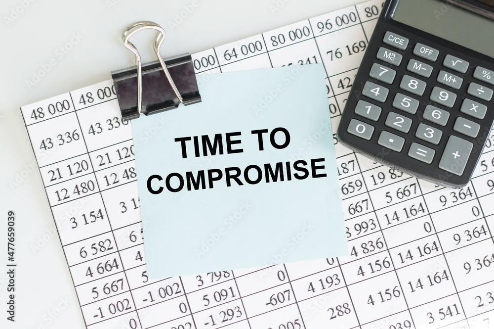 Poster time to compromise - business concept, text on a bare sticker on the background of the report next t
