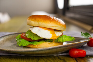 Egg and Avocado Bun Sandwich. English breakfast.