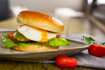 Egg and Avocado Bun Sandwich. English Breakfast