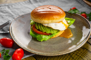 Egg and Avocado Bun Sandwich. English Breakfast.