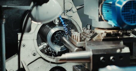 High-precision CNC machining center works, the operator of the automotive sample processing part of...