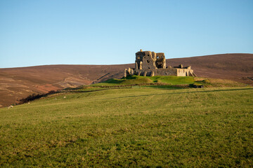 Fototapeta na wymiar Ruined castle on top of a hill in moray scotland